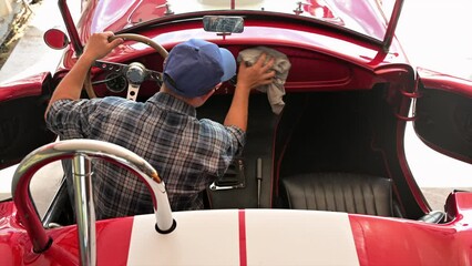 Wall Mural - A Man Cleaning His Classic American Muscle Car Interior