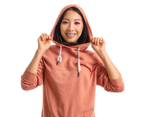 Young Asian woman in stylish hoodie on white background