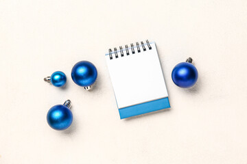 Wall Mural - Blank paper calendar with Christmas balls on white background