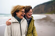 © InputUX - Two joyful women embracing on a breezy beach, their laughter echoing the waves. Windswept hair and warm scarves hint at shared stories and deep connections against a seascape backdrop.