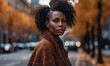 portrait of young african american woman in coat in city.portrait of young african american woman in coat in city.young african american woman in autumn city street.