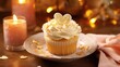 A decadent cupcake featuring a moist and zesty lemon cake base, elegantly crowned with a light citrus ercream that has been skillfully shaped into a charming heart design. The delicate sugar