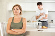 © JackF - Young guy screams during family quarrel with woman in kitchen