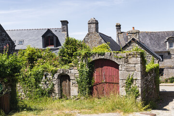 Wall Mural - old stone buildings in the historic old town of Locronan, France