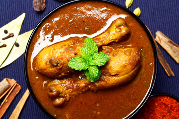 Wall Mural - Spicy chicken curry in bowl, chicken masala