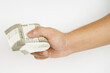 Bundle of indian rupees in hand on white background