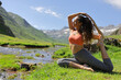 © Antonioguillem - Yogi practicing yoga in a mountain valley