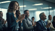 © javier - In a modern conference room a team leader applauds a dedicated colleague for their exceptional contributions to a successful project