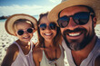© Michael - Selfie of young happy family at the beach