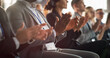 © Gorodenkoff - Close Up on Hands of Audience of People Applauding in Concert Hall During Business Forum Presentation. Technology Summit Auditorium Room With Corporate Delegates. Excited Entrepreneurs Clapping.