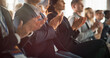 © Gorodenkoff - Close Up on Hands of Audience Applauding in Concert Hall During Business Forum Presentation. Technology Summit Auditorium Room With Corporate Delegates. Excited Entrepreneurs Clapping.