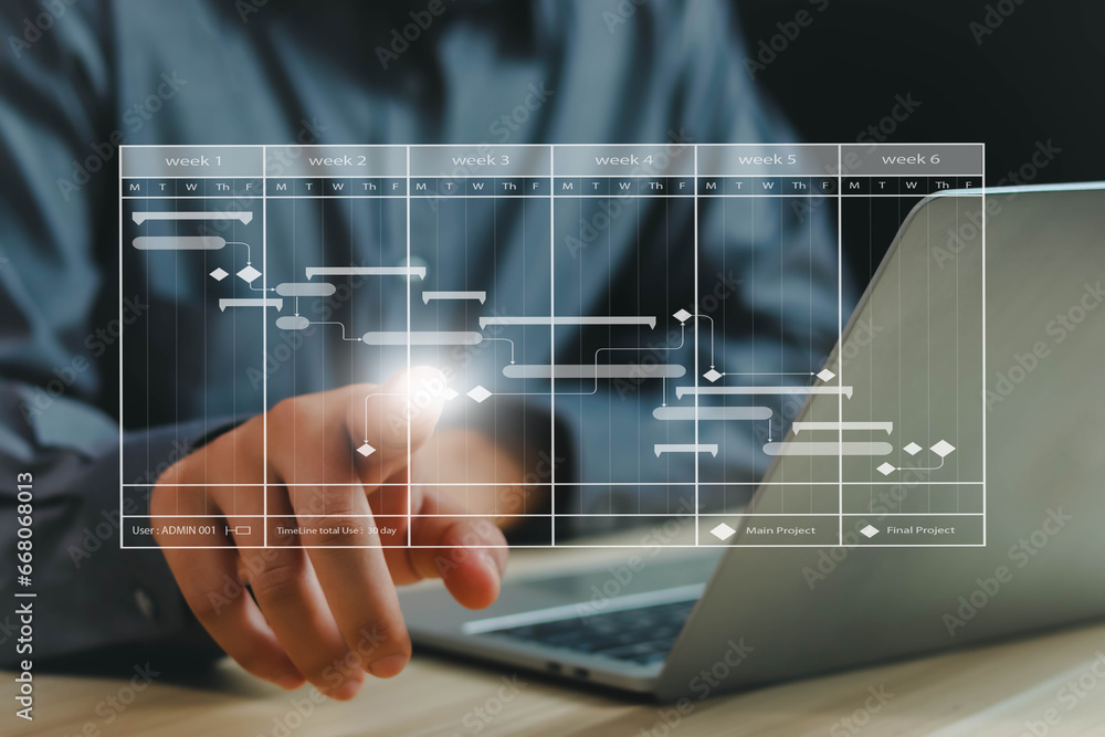 Work Programme Updates Businessman shows work project plans and updates work by planning ...