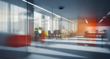 Beautiful Blurred Background Of A Modern Office Interior In Gray Tones With Panoramic Windows, Glass Partitions And Orange Color Accents.