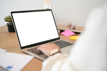 Poster - Woman had using laptop white screen and stationery on the table in house.