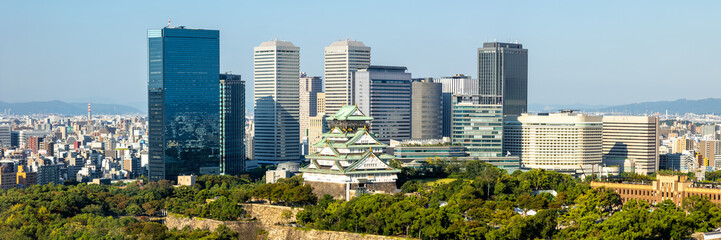 Wall Mural - Osaka Castle from above skyline with skyscraper panorama in Japan
