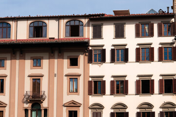 Wall Mural - Colorful historic streets of Florence, Italy. Narrow old street, building's facade, brick walls.