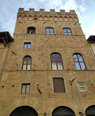 Canvas Print - Colorful historic streets of Florence, Italy. Narrow old street, building's facade, brick walls.