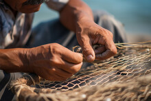 The Worn-out Hands Of A Man Weaving A Fishing Net. Heritage Craft