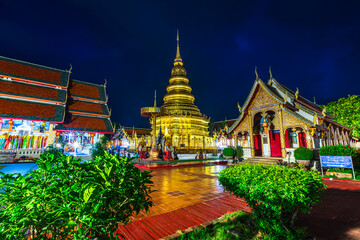 Beautiful of Night,evening the golden pagoda at Wat Phra That Hariphunchai is a Buddhist worship temple It is a major tourist attraction In the city of Lamphun Thailand.