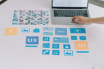 Wall Mural - creative ux ui designer working on screens for mobile responsive website development, focusing on ui