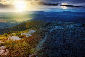 Wall Mural - mountain landscape with sun and moon at twilight. hillside with stones in grass. day and night time 