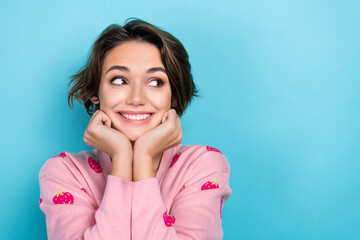 Poster - Portrait of adorable positive person arm touch cheekbones beaming smile look empty space isolated on blue color background