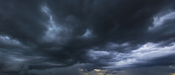 Aufkleber - The dark sky with heavy clouds converging and a violent storm before the rain.Bad or moody weather sky and environment. carbon dioxide emissions, greenhouse effect, global warming, climate change