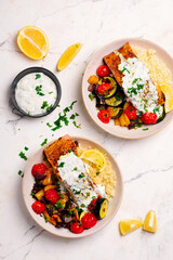 Wall Mural - Moroccan  salmon with vegetables and couscous