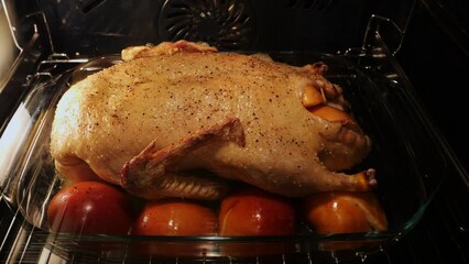 Wall Mural - Baked duck in the oven with stuffed apples. Time lapse. Close Up. Christmas. Holiday dish