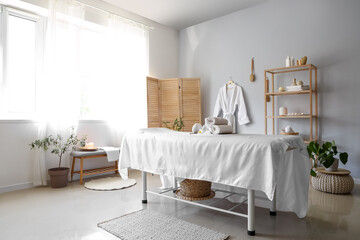 Poster - Interior of spa salon with couch and shelf unit