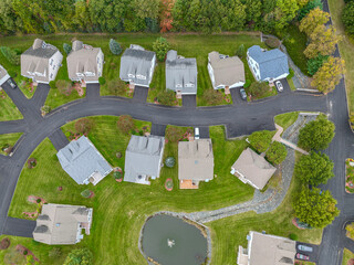 Wall Mural - aerial drone view of neighborhood street with single family homes in autumn