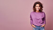 An Indian woman wearing violet sweatshirt isolated on pastel background