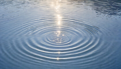 Wall Mural - water blue ripples with sunlight top view background circle wave pattern water well free space display product transparent blue clear water surface texture with ripples splashes abstract summer