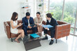 © Singh - Portrait business team woman pretty girl and man handsome Asian group teamwork meeting sitting on desk looking hand holding laptop notebook serious consider working for new project inside home office.