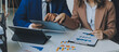 © ARMMY PICCA - Team of business people working together in the meeting room office, teamwork background charts and graphs banner, double exposure successful teamwork,business planning concept.