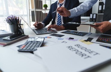 Wall Mural - Asian male financial officer or accountant checking investment results Financial budget analysis Planning to summarize results and report to the meeting Audit concept and investment results.