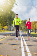 Sport Concepts. Positive Running Couple During Happily Jogging Outside as Runners Training Outdoors Working Out in City