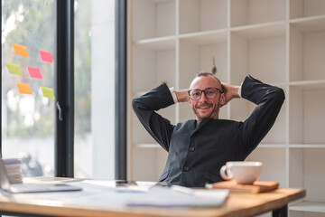 Wall Mural - portrait of Happy businessman looking at laptop computer in office, Excited man working at his workplace at modern co-working, successful people