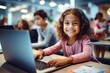 Portrait of little girl using laptop, studying online at school, interested happy schooler typing on keyboard looking at camera