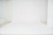 A photo studio with a white cyclorama for a professional photo shoot. 