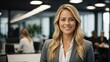 © Tom - Young Blonde Businesswoman Smiling in Office Setting