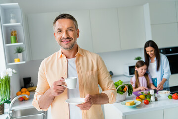 Sticker - Photo of sweet positive husband wife little girl enjoying morning beverage cooking together indoors apartment kitchen