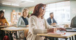 © Gorodenkoff - Portrait of a Happy Senior Woman Taking a Course in an International Adult Education Center. An Alderly Female Wearing Glasses, Sitting Behind a Desk, and Writing Down Notes in a Notebook.