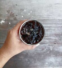 Canvas Print - Iced coffee black on wood background