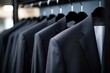 © altitudevisual - detail shot of a black business suit hanging on a rack