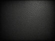 © Ombréa - Black leather texture, A close-up view of a black leather texture with small, irregular cracks and creases, abstract black background