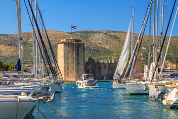 Coastal summer landscape - view of the marina and Kamerlengo Castle of the town of Trogir, the Adriatic coast of Croatia