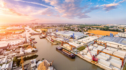 Canvas Print - Industrial buildings and dock landscape at sunset