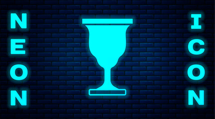 Poster - Glowing neon Christian chalice icon isolated on brick wall background. Christianity icon. Happy Easter. Vector