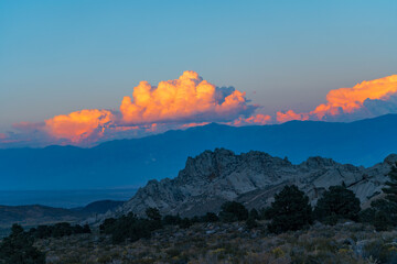 Wall Mural - Cloudy morning in the Buttermilks, at the foothills of the Sierra Nevada Mountains in Bishop California. Fall colors and snow capped mountains with large clouds.